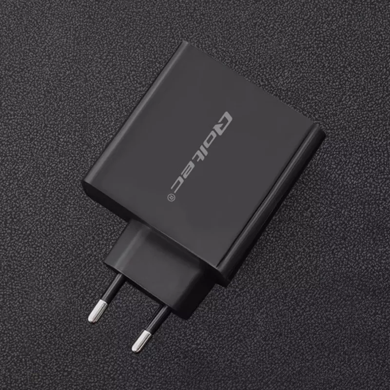 Barošanas adapteris QOLTEC 51716 — maiņstrāva 220–240 V līdz 20 V 3 A (63 W), melns, iekštelpu universāls lādētājs