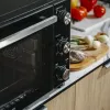 Elektriskā kompakta galda krāsns Adler AD 6026 — 48 L ietilpība, 1800 W, brīvi stāvoša, mehānisks taimeris