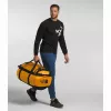 The North Face Base Camp Duffel L sporta soma 95 L, poliesters, melna, dzeltena