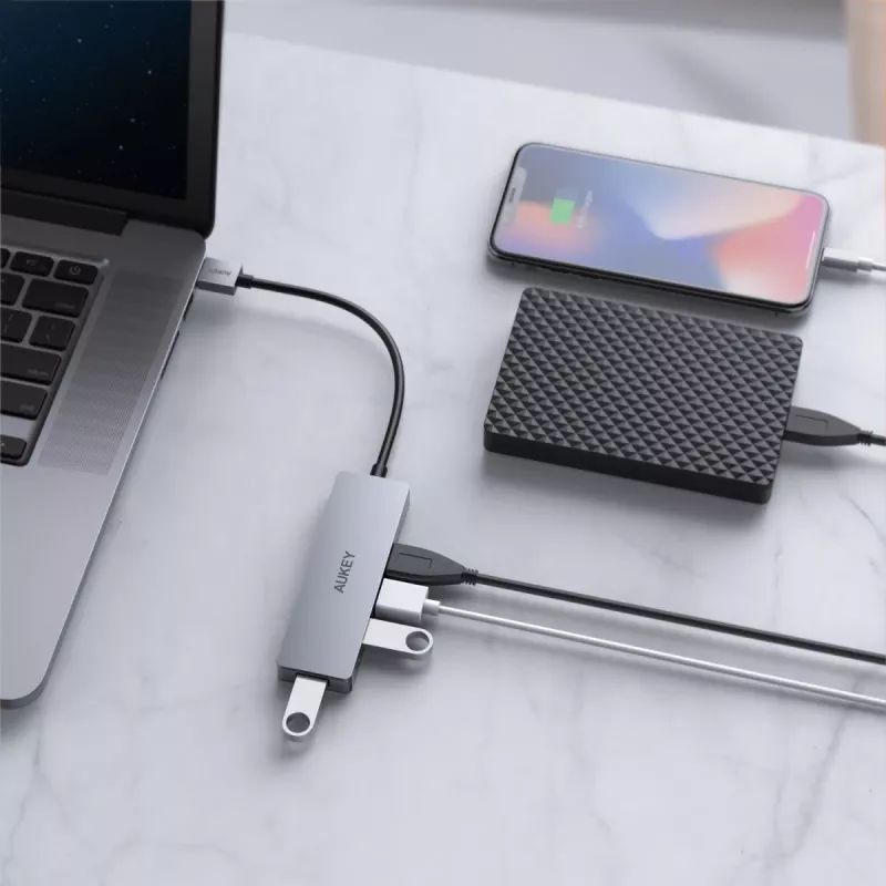 USB centrmezgls Aukey CB-H36 — 4 portu USB 3.2 Gen 1 Type-A, resursdators USB 2.0, 5000 Mbit/s, alumīnijs sudraba krāsā