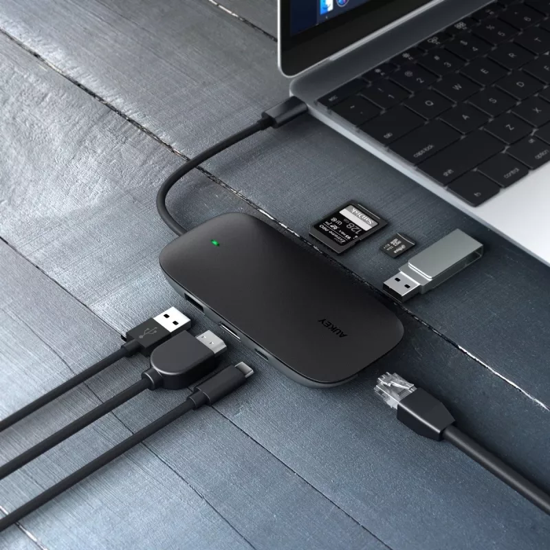 Klēpjdatora dokstacija AUKEY CB-C71 — 3x USB‑C (USB 3.2 Gen1), HDMI, RJ‑45, MicroSD, USB PD 100W, 0,15 m kabelis, melna