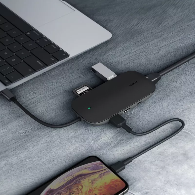 Klēpjdatora dokstacija AUKEY CB-C71 — 3x USB‑C (USB 3.2 Gen1), HDMI, RJ‑45, MicroSD, USB PD 100W, 0,15 m kabelis, melna