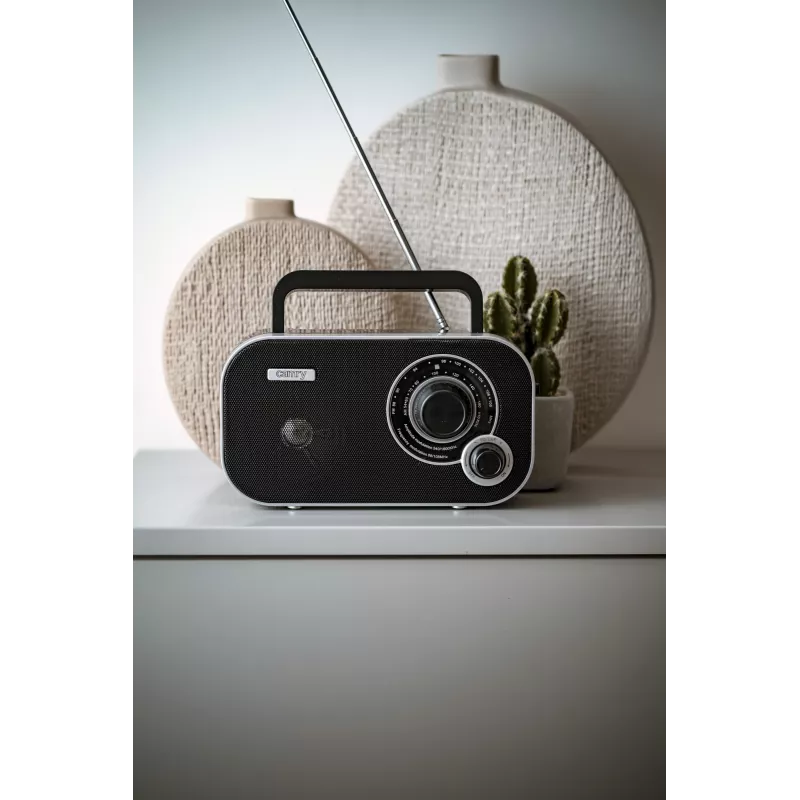 Pārnēsājamais radio Camry CR 1140b — AM/MF, pelēks, maiņstrāvas vai bateriju barošana, kompakts 280×65×113 mm