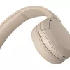 Sony WH-CH520 Bezvadu austiņas, galvas saite, zvaniem/mūzikai, USB Type-C, Bluetooth, uzlādes statīvs, krēmkrāsas