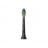 Zobu birstes galviņas Philips HX6064/88 Optimal balta — 4 gab., melnas, vidēji cieti sariņi, 62 000 kustību/min