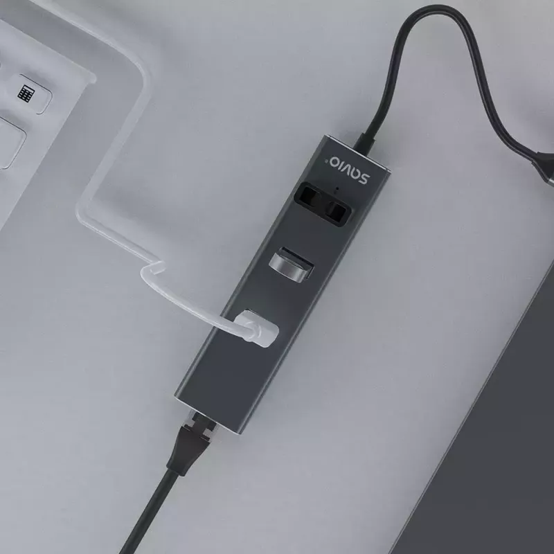 USB-C centrmezgls SAVIO AK-57 ar 3 × USB-A, RJ-45 Gigabit Ethernet (5000 Mbit/s), alumīnija pelēks