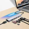 Manhattan USB-C dokstacija/rumbis ar karšu lasītāju, 5 pieslēgvietas: Ethernet, HDMI, USB-A (x2) un USB-C, ar Power Delivery (PD) 100 W – nepieciešams ārējs USB-C lādētājs (nav iekļauts). Barošana caur USB (ārējs barošanas avots nav nepieciešams), kad PD netiek izmantots.
