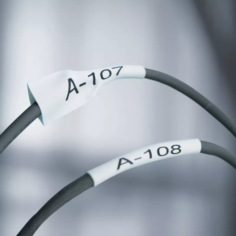 DYMO Rhino Industrial Heat-Shrink kabelis Label Tubes | 24 mm x 1,5 m | Melna druka uz dzeltena | Rhino etiķešu printeriem