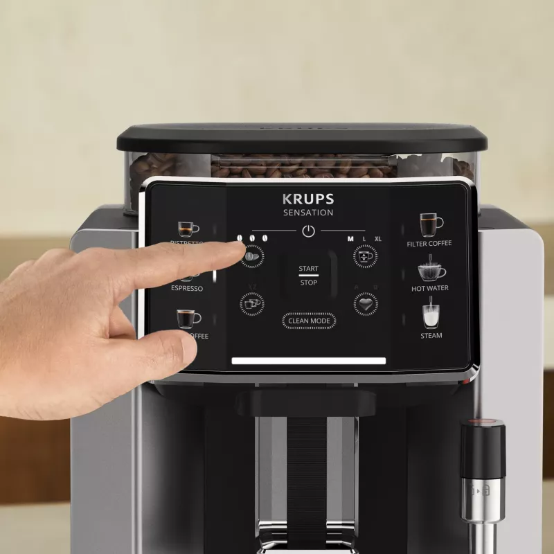 Espresso automāts KRUPS Sensation EA910E — pilnībā automātisks, 1,7 l ūdens tvertne, iebūvēta dzirnaviņas, 2 snīpi, 1450 W