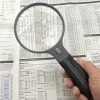 Lupa Carson Split Handle HF-11 — 3,5× rokas palielināmais stikls, melns/caurspīdīgs, AAA baterijas