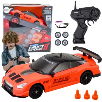 LEAN TOYS Ar tālvadību vadāma sporta automašīna 1:24 Oranža ar maināmiem riteņiem