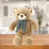 LEAN TOYS Plīša maskots mīkstā rotaļlieta lācītis ar krāsainu vilnas šalli brūns 55cm