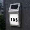 LEAN Saules LED sienas lampa ar mājas numura apgaismojumu, nerūsējošais tērauds