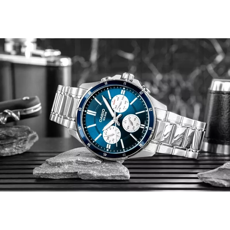 Casio MTP-1374D-2A3 Vīriešu analogais kvarca pulkstenis ar nerūsējošā tērauda rokassprādzi, zilu ciparnīcu, datumu un dienu, 50m ūdensizturība