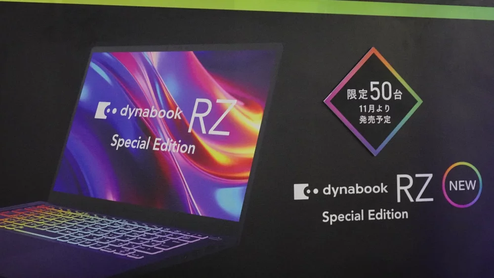 Laptops on display with product information cards